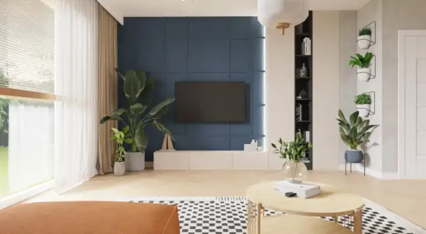 Nowoczesny salon z niebieską ścianą, telewizorem i roślinami.